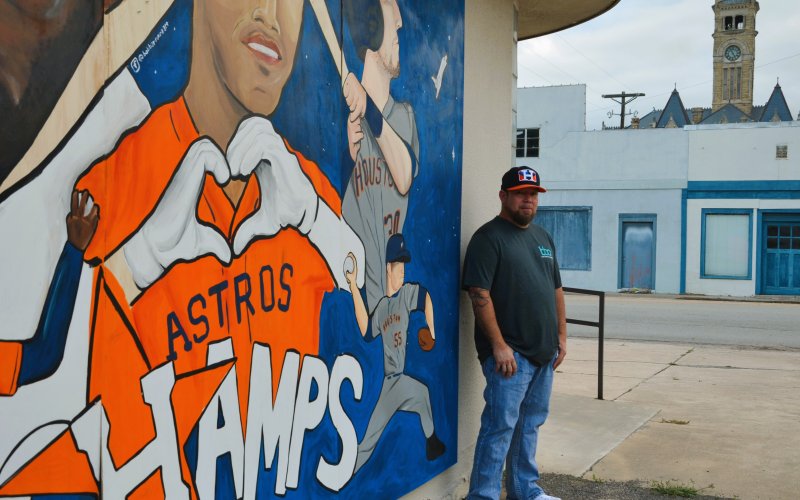 Bob Barrera poses in front of a mural dedicated to the Houston Astros outside his studio, Created, by Bob Barrera Originals, Nov. 11.  Photos by Hans Lammeman