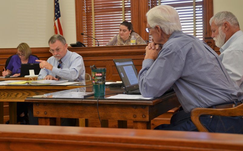 County Judge Daryl Fowler and commissioners discuss agenda items Monday, Nov. 28.  Photo by Hans Lammeman