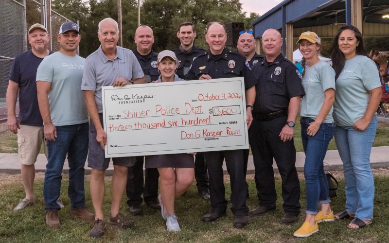 Pictured are, left to right, Greg Chumchal, James Taumoepeau, Douglas Kaspar, Sgt. James Whited, Laura Kaspar, Officer Greg Proske, Chief Kevin Kelso, Sgt. Kevin Kelley, Officer Michael Hudson and Hali Kaspar.