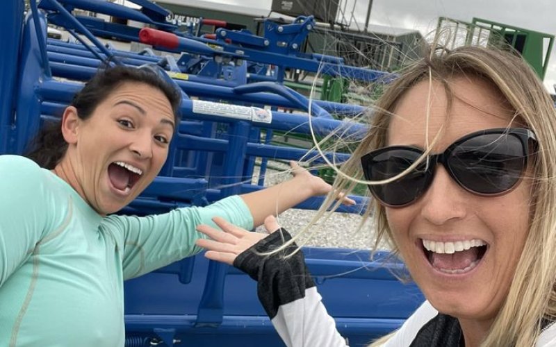 (From left) Brittani Richter and Kim Chandler pose with the roping chute purchased for the Yoakum Rodeo Arena.  Contributed Photo