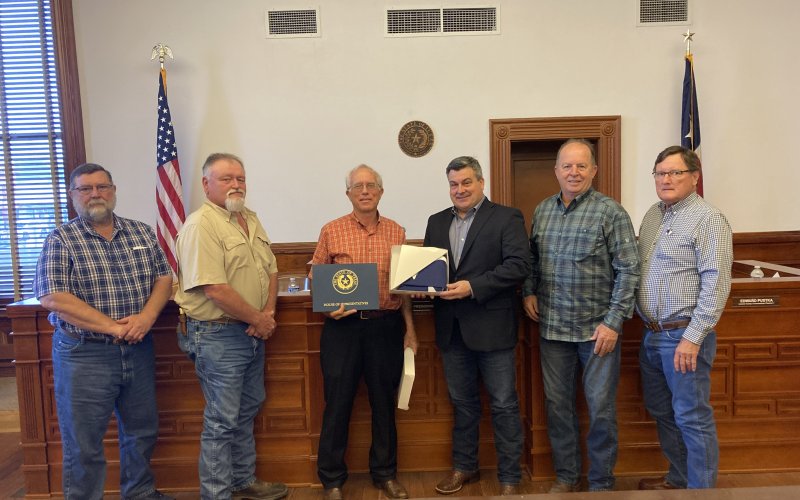 At Monday’s Commissioners’ Court meeting, Lavaca County legislature chairman Paul Yamarick presented the court with a Texas flag. The flag flew over the Capitol on Monday, March 13, the day the state legislature held Lavaca County Day at the Capitol. From left are commissioners Dennis W. Kocian, Kenny Siegel, Yamarick, Judge Keith Mudd and commissioners Wayne Faircloth and Edward Pustka. Photo by Jimmy Appelt