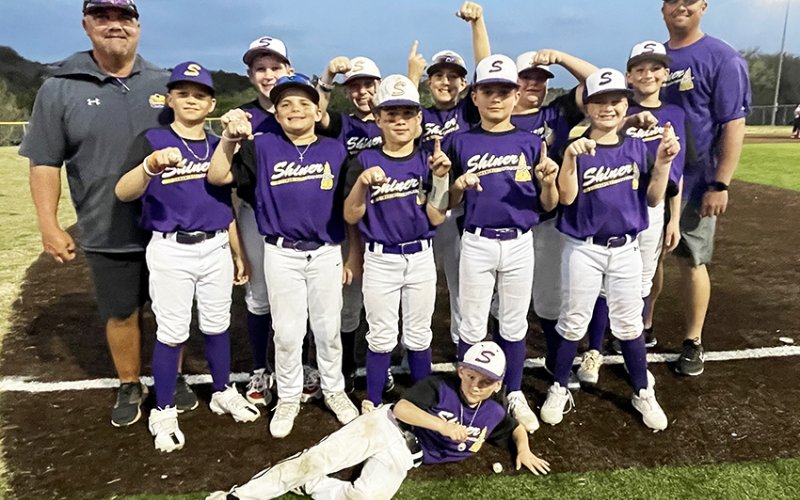 Pictured with their championship rings are front row Kannon Keller, second row Grayson Neskora, Garrett Fric, Luke Polasek, Colby Strezlczyk, Back Row Jason Keller, Owen Burke, Killian McDonald, Conley Patton, Landen Neskora, Reid Simper and Bryan Neskora. Photo courtesy of Jason Keller.