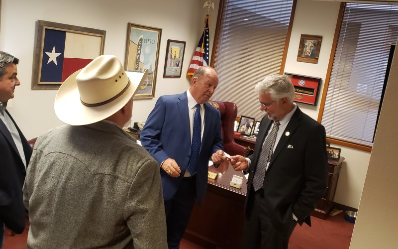 County officials meet with the vice chair of the county affairs committee in the House.