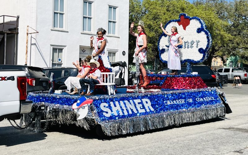 The Shiner Chamber float passes through downtown Goliad during the Rodeo Parade.