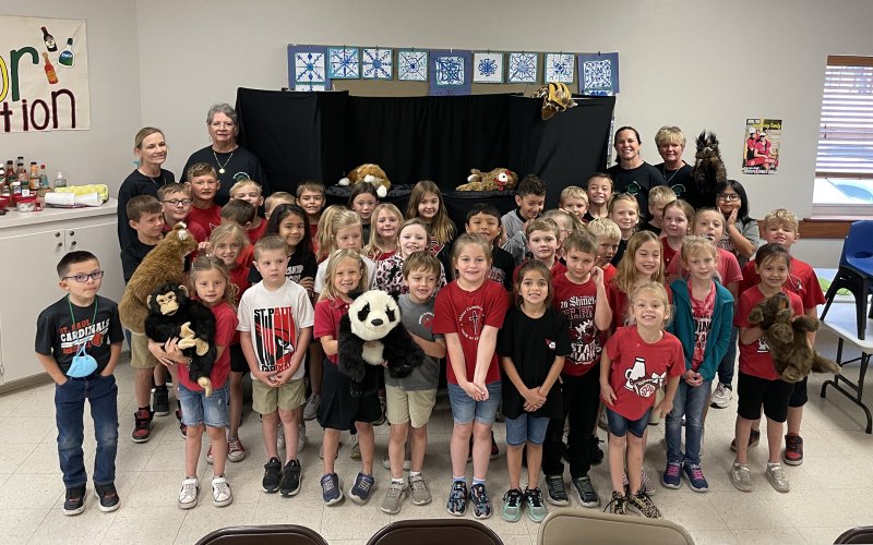 First and second grade students from St. Ludmila Elementary with members of the Shiner Pilot Club.