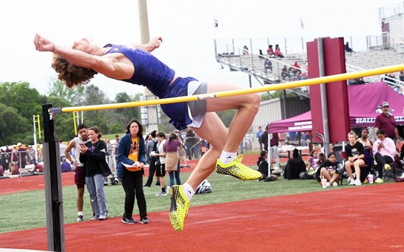 Trace Bishop makes a high jump Thursday afternoon in Hallettsville. He gained the Comanches 10 points with first place in the event. Photo by Mark Lube.