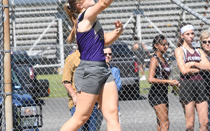 Kailey Boedeker releases her discus during the event.She took first place and also won the shot put to be one of several athletes advancing to regionals in Kingsville next week. Photo by Mark Lube.