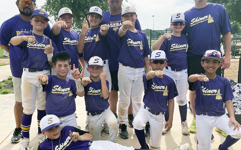 Pictured with their championship rings are front row Garrett Fric (MVP), second row kneeling Kolt Keller, Kannon Keller, Nicholas Villa, Tres Villa, Back Row Coach George Villa, Grayson Neskora, Landen Neskora, Conley Patton, Coach Jason Keller, Killian McDonald, Colby Strezlcyzk and, Coach Greg Strezlczyk. Photo Courtesy of Stephanie Keller.