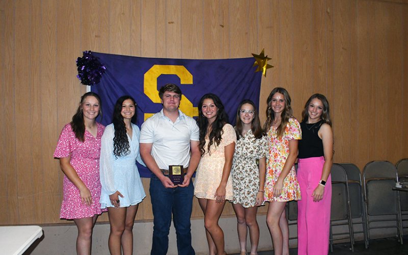 Cheerleaader Beau is Dalton Patton (third from left) along with Paeden Vincik (left), Brooke Palmer (second from left), Riley Rainosek (middle), Grace Migl (third from right), Aimee Mitchon (second from right) and Callie Sevcik (right).  Photo by Mark Lube.
