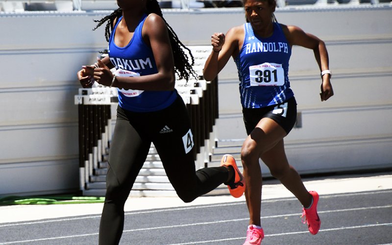 ayana Phillips races ahead of UCR to win the 400-meter dash Saturday in the Region IV-3A meet in Seguin. Photo by Mark Lube.