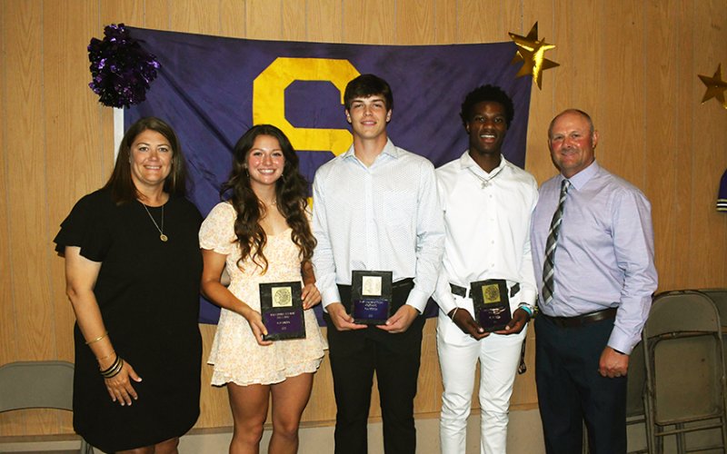 Most Outstanding Athlete Award winners are Riley Rainosek (second from left), Ryan Peterson (middle) and Dalton Brooks (second from right) along with Desiree Nitsch (left) and Daniel Boedeker (right). Photo by Mark Lube.