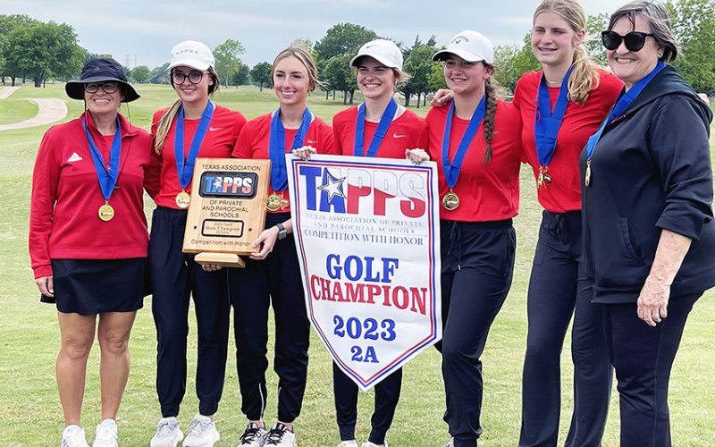 The Lady Cardinals pose with their trophy and banner from 2A state golf championship. From left is head coach Nicco Brown, Audrey Thibodeaux, Cortney Tuch, Anna Reeves, Emily Stamport, Riley Mozisek and assistant coach Pat Chilek.Photo courtesy of Nicco Brown.