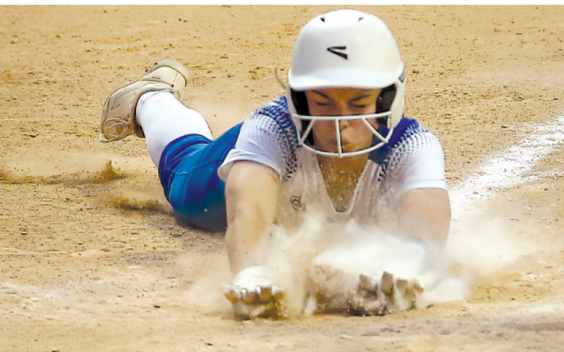 Ava Lackey scores on a wild pitch in the fifth inning Chuck Grafe/Tribune-Herald