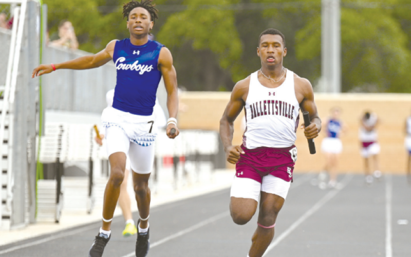Damarion Austin anchors the second place sprint relay. Chuck Grafe/Tribune-Herald