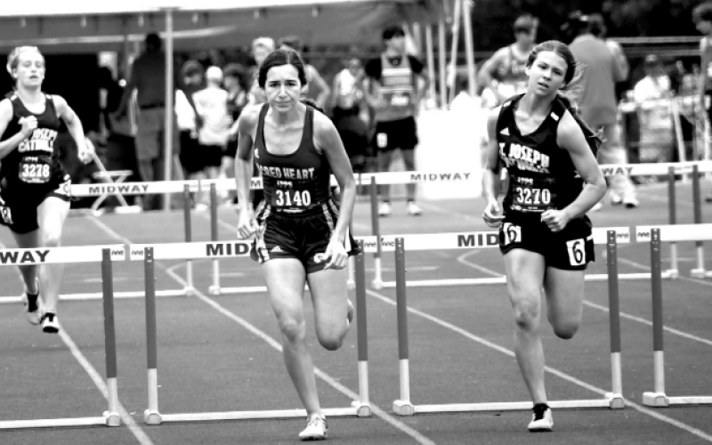 Arianna Henke, center, ran the last race of her career at the TAPPS state meet. Mark Lube/Shiner Gazette
