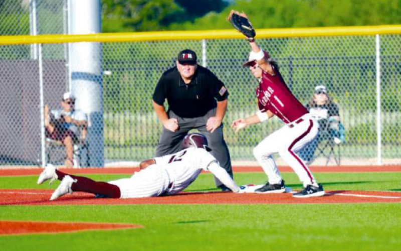 Jorian Wilson easily gets back to first-inning pickoff attempt.
