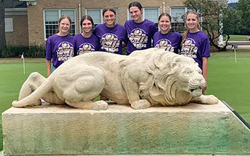 Behind the statue at Lions Golf Course, from left is  Grace Migl, Lauren Faldyn, Chelsea Whiddon, Morgan Lenehan, Brianna Sofka and Megan Winkenwerder. Photo courtesy of Michelle Winkenwerder.