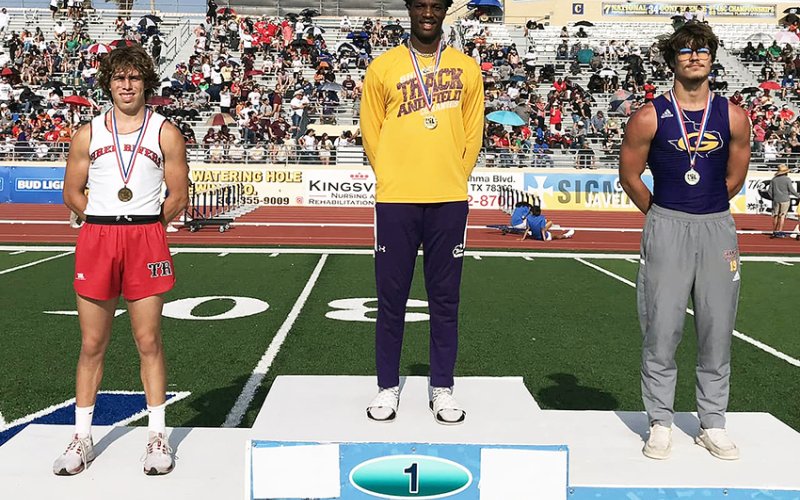 Dalton Brooks (center) won the long jump and set a Region IV-2A record with a jump of 23 feet, 8 3/4 inches. Photo courtesy of Randy Palmer.