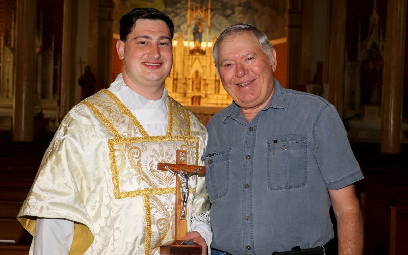 Mr. Picha presented the crucifix too the soon-to-be priest at his home parish here in Shiner, just a days ago during a photo shoot with Michelle Price, who incidentally took portraits of Ryan when he entered the seminary and, a decade later, just before he became a priest.