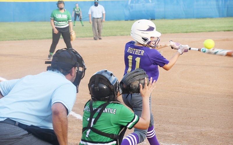 Presley Rother makes contact in the first inning of Shiner Major Softball’s East Zone tournament-opening game against Luling on Friday night. Shiner won 16-0 in three innings. Photo by Mark Lube.