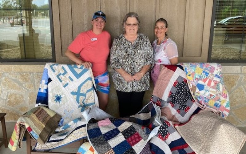 Pictured are, left to right, Torye Gleitz, Operations Coordinator at Morgan’s Wonderland, Janet Ferguson, Shiner Heritage Quilters President and Diane Price, Executive Administrative Assistant.
