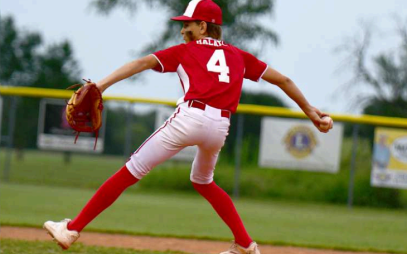 Will Halata delivers the first pitch in the game Monday night.