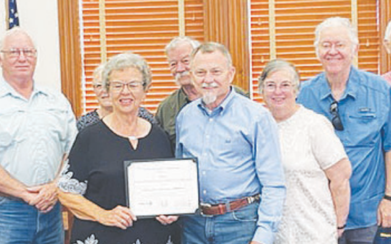 DeWitt County commissioners present a recognition to members of the DeWitt County Historical Commission for the group’s active and well-balanced preservation program at Monday’s county business meeting.