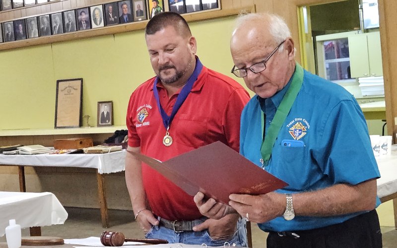 District Deputy Reggie Guettner, right, past Grand Knight of Shiner’s Council 3081 in Shiner and current council trustee presents current Grand Knight Mark Yackel a proclamation from the National Council recognizing the local council’s many achievements in its first 75 years.