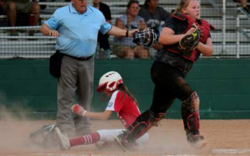 Kinley Migl scores a run in a previous win. Chuck Grafe/TribuneHerald