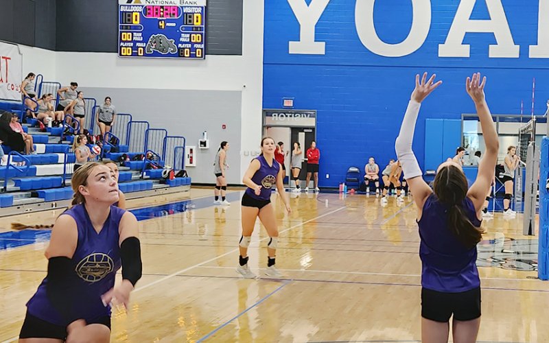 Shiner players Chelsea Whiddon (foreground left), Chesney Machacek (background) and Meghan Blaschke (foreground right) in action in a scrimmage in Yoakum on Friday. Photo by Nadine Rex/Yoakum Herald-Times.