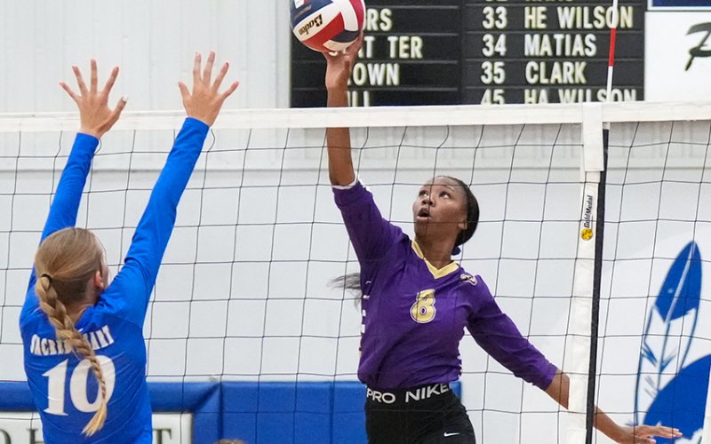 Shiner’s JaMya Wright scored on this spike against Sacred Heart. The Lady Comanches won in three sets. Photo by Howard Esse.