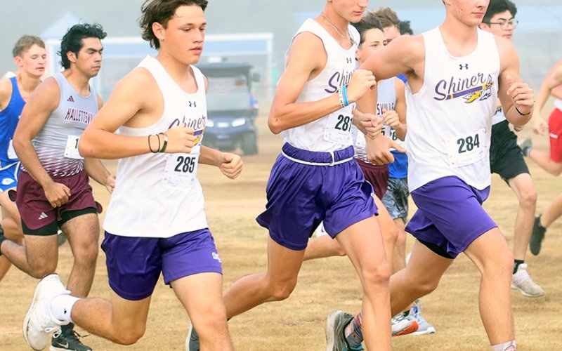 Shiner boys cross country runners from left are Elijah Mesa, Boe Boehm and Kade Matula during the boys varsity race in Yoakum on Saturday. Shiner placed No. 13 with 303 points.  Photo by Raymond Rosas.