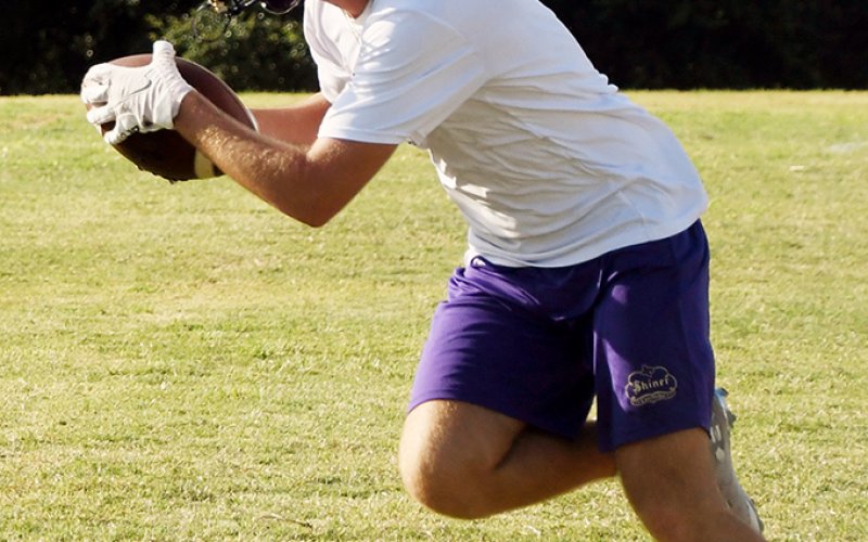 Shiner junior Caleb Lehnert carries the football during an evening practice last week. Shiner scrimmages at Tidehaven this week and hosts Burton next week in the Towel scrimmage.First game is Aug. 25 at home to Hallettsville.  Photo by Mark Lube.