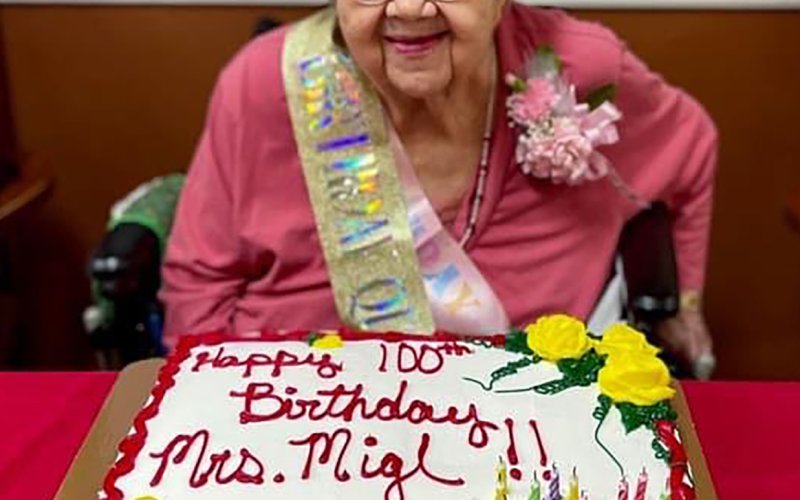 Millie Migl is shown with her birthday cake.