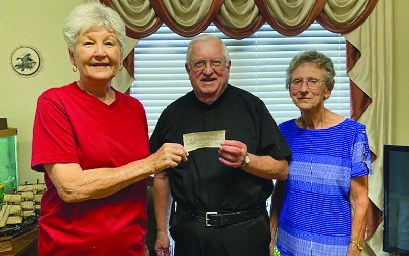 Wied KJZT Society #53 recently held a church fundraiser to offset the maintence costs of four cemeteries - St. Mary’s, St. Ludmila of Wied, St. Augustin of Worthing and St. Anthony of Witting. Pictured, left to right, are Helen Janak, Msgr. John Peters and Anita Grabarkievtz.