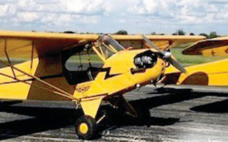 These are the 1946 Piper J3 Cubs, just like the model that’s getting raffled off. The Barnstormers Museum has three of these planes.