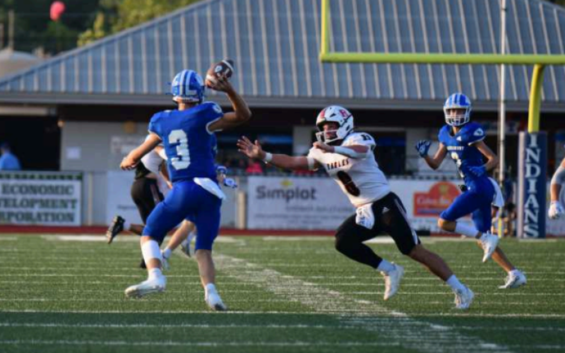 Quarterback Andrew Steffek completes a 19-yard pass to Hudson Kutac (2) on the Indians’ first play from scrimmage. Chuck Grafe/Tribune-Herald