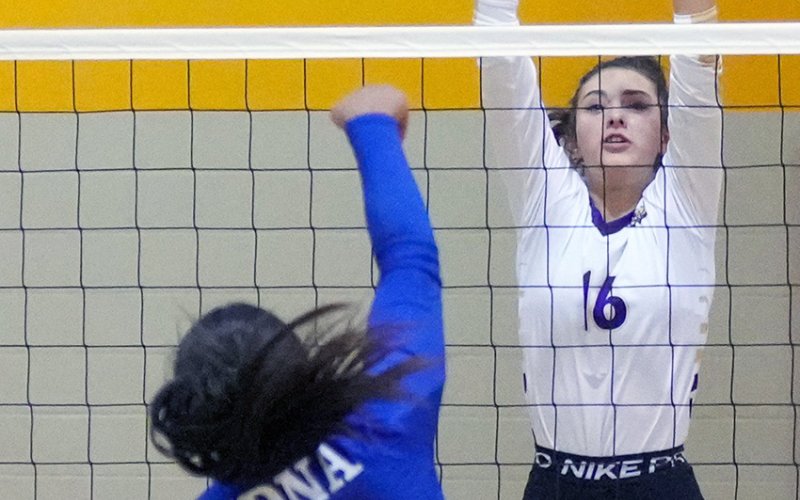 Morgan Lenehan gets close to blocking an Edna shot Aug. 15 in Shiner’s three-set win over the Cowgirls. Photo by Howard Esse.