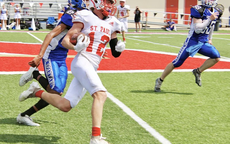 Blaine Humes gains a few yards on one of his seven carries. He totaled 77 yards on the ground and one touchdown in St. Paul’s win over Dallas CHE Saturday in Temple. Photo courtesy of Brian and Louann Heinsohn.