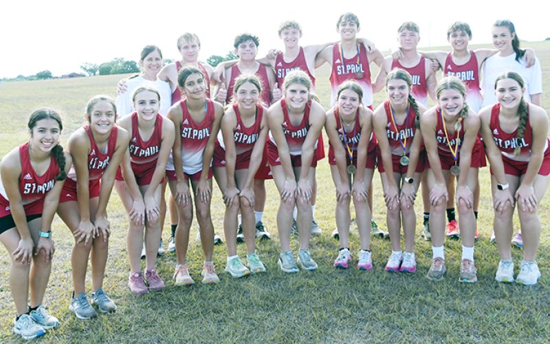 The St. Paul Lady Cardinals got second place at the Shiner meet on Saturday while the St. Paul boys were sixth. Bottom row from left aare Julia Barecky, Eden Rodriguez, Frances Filip, Nora Koch, Sally Machacek, Riley Mozisek, Kristin Cerny, Brooke  Cerny,Skylar Mozisek and Faith Brown. Top from left are head coach Nicco Brown, Alex Brown, Jackson Seibert, Carter Chilek, Gabe Darilek, Nathan Timmons, Hunter Zella and assistant coach Emma Mikulik. . Photo by Mark Lube.