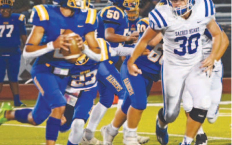 Josh Terry chases down Bruni quarterback Albert Esquivel. Melissa Kutac/Tribune-Herald