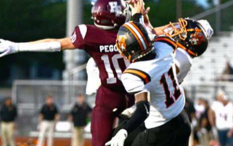 This pass was out of reach of Mycole Pegoda (10), but nonetheless led the Brahmas in receiving with 3 for 29 yards. Chuck Grafe/