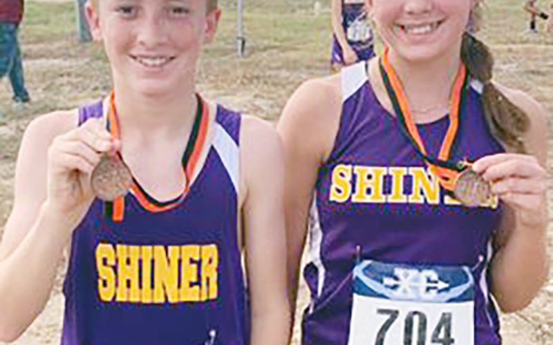 Carson Christensen (left) was top finisher for the Braves with No. 19 in less than 14 minutes. Emerysn Boehm (right) was No. 14 for the Lady Braves with 15:46. Photo courtesy of Michelle Winkenwerder.