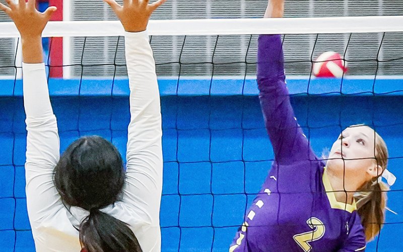 Callie Sevcik makes a play at the net against Nixon-Smiley. She had two kills, four digs, one assist and a block in the match against the Lady Mustangs. Photo by Howard Esse.