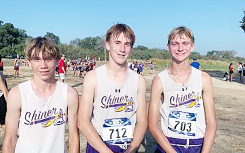 Shiner boys cross country runners at Gonzales Invitational. From left is Caleb Cowan (No. 59), Landen Christensen (No. 48) and Boe Boehm (No. 42). Photo courtesy of Michelle Winkenwerder.