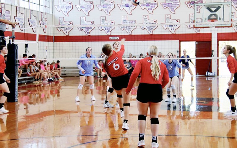 Avery Pesek (second from left) plays a ball on the net with Sam Moeller (left), Maurin Knesek (second from right) and Dallyn Pesek (right) also on the play during last week’s home match vs  Bulverde Bracken. Photo courtesy of Brian and Louann Heinsohn.