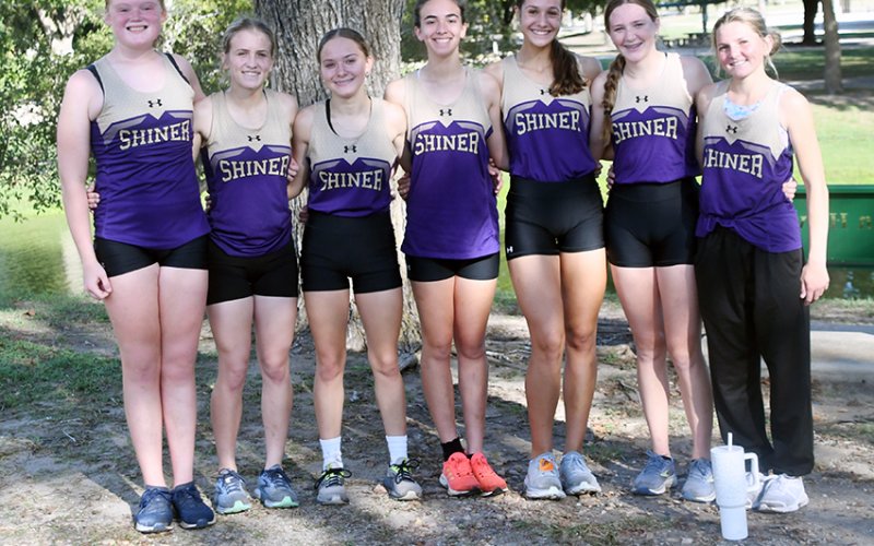 Shiner Lady Comanches XC District champions . From left are Eve Roberts, Hayleigh Burns, Emma Joslin, Megan Burns, Erin Pustka, Callie Chrismon and Jo Caka. Photo by Mark Lube.