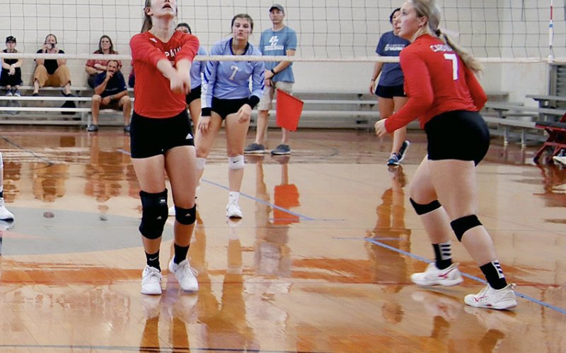 Dallyn Pesek (left) and Faith Machart in action during a recent St. Paul home match. The Lady Cards hosted Sacred Heart  Tuesday of this week. Photo courtesy of Brian  and Louann Heinsohn.