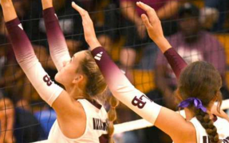 Sophomore Adison Bujnoch (3) and freshman Jans Henke get ready at the net. Chuck Grafe/Tribune-Herald