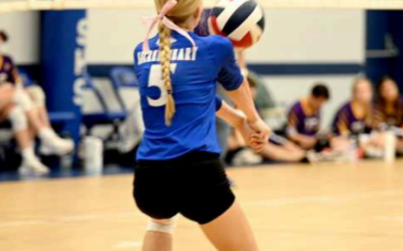 Alyssa Zbranek passes to the front row in a recent home match. Chuck Grafe/Tribune-Herald